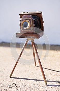 Brihuega, Spain 01/12/2020 Vintage bellows camera with wooden tripod