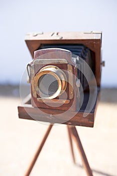 Brihuega, Spain 01/12/2020 Vintage bellows camera with wooden tripod