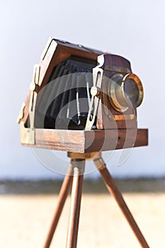 Brihuega, Spain 01/12/2020 Vintage bellows camera with wooden tripod