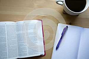 Vintage Bible study with pen view from the top with coffee