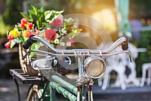 Vintage bicycle with bouquet flowers in basket