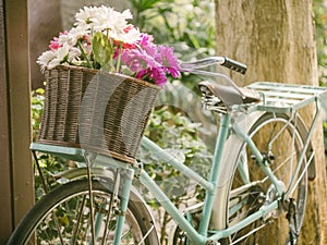 Vintage bicycle with flowers in basket
