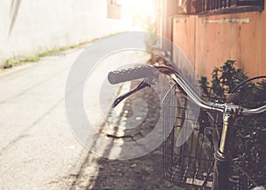 Vintage bicycle handlebar parked in the urban narrow street