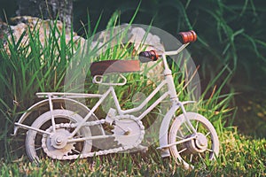 Vintage bicycle miniature toy waiting outdoors