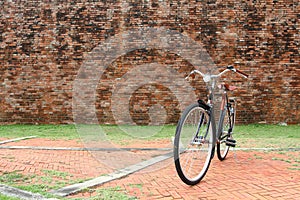 Vintage bicycle and red brick wall