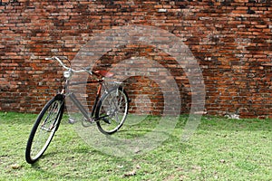 Vintage bicycle and red brick wall