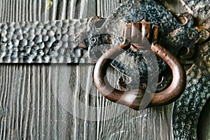 Vintage Big Copper Door Handle on a wooden door