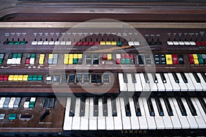 The Vintage Big Piano Keyboard. Many keys and buttons on a big old brown church organ. Bangkok, Thailand in January 5, 2020