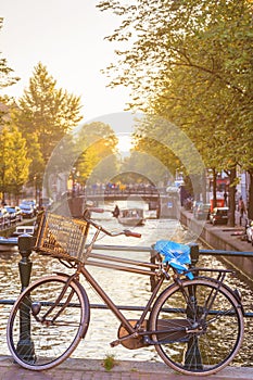 Vintage bike with canal in Amsterdam