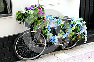 The vintage bike of flowers photo