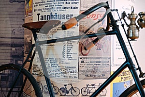 Vintage bike in front of vintage poster stand