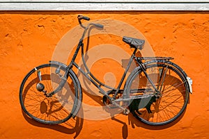 Vintage bike hanging on a wall