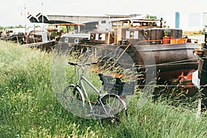 Vintage bike near living boat