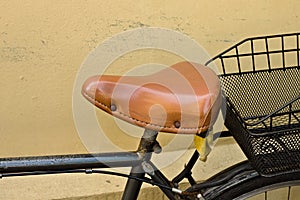 Vintage bike saddle made of brown leather Pesaro, Italy