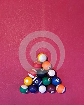 vintage billiard balls set on a red pool table