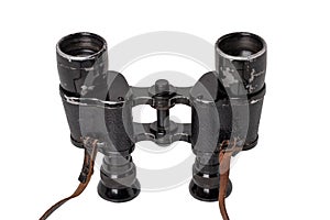 Vintage binoculars isolated. Close-up of an old german Binoculars with leather straps used from military during the second world