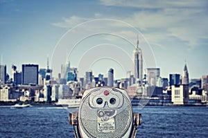 Vintage binoculars viewer, Manhattan skyline with the Empire State Building, New York City USA