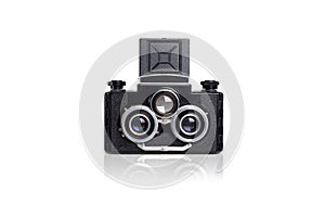 Vintage black camera with three lenses on white background, stereo camera