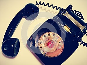 A vintage and antique telephone with white background. photo