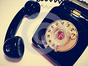 A vintage and antique telephone with white background. photo