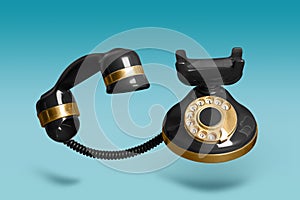 Vintage black corded telephone flying in air on light blue background