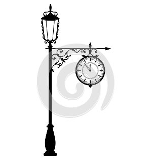 Vintage black lamppost with clock isolated on white