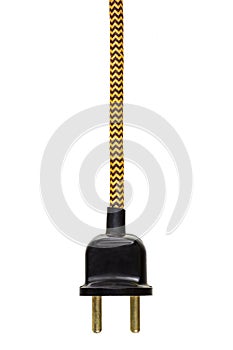 Vintage power plug with yellow cord isolated on white