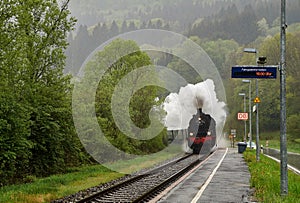 Vintage black steam locomotive train rush railway.