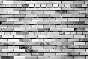 Vintage black white brick wall background, diagonal position, stone texture. The best tile, black white decorative material,