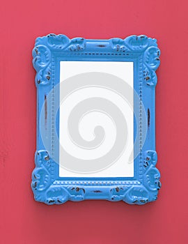 Vintage blank blue photo frame over red background. Ready for photography montage. Top view from above.