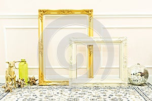 Vintage blank golden and white wooden frames and decorative thin