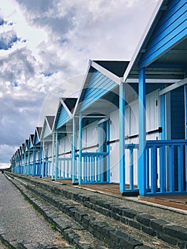 Vintage blue beach huts in a row