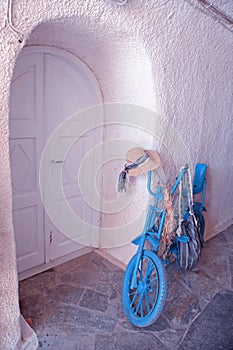 Vintage blue bike with white door, Greece
