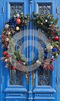 Vintage blue door with christmas wreath decoration