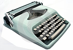 Vintage blue typewriter isolated on white