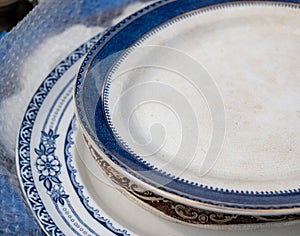 Vintage blue, white porcelain plates at the flea market