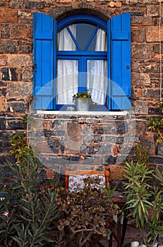 Vintage blue window, Greece.