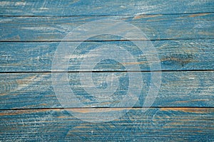 Vintage blue wood background texture with knots and nail holes. Old painted wood. Blue abstract background.