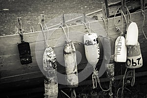 Vintage boat buoys and fenders by the sea photo