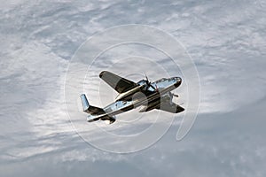 Vintage bomber airplane with dramatic clouds