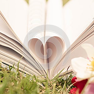 Vintage book heart shape, dept of field.