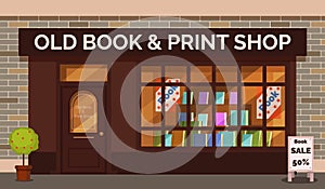 Vintage book shop store facade with storefront large window, columns and brick wall