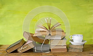 Vintage books with a coffee cup