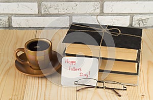 Vintage books, glasses, Cup of coffee on a wooden table