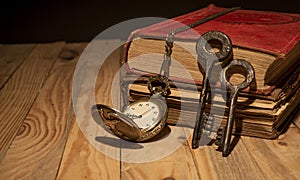 Vintage books with old keys and pocket clock - education and wisdom theme