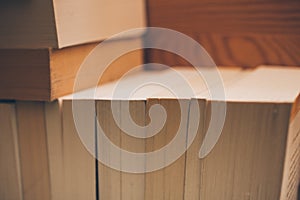 Vintage books on wooden background. Close up view of books background for design. Old books on a shelf.