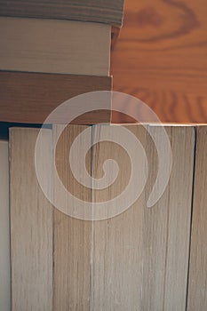 Vintage books on wooden background. Close up view of books background for design. Old books on a shelf.