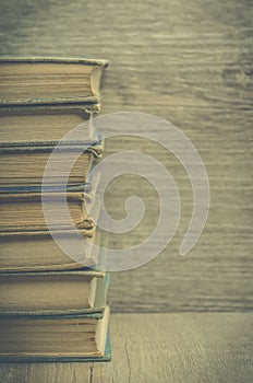 Vintage books on a wooden bookshelf