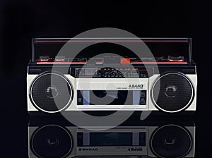 Vintage boom box on black background