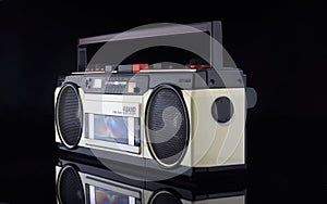 Vintage boom box on black background